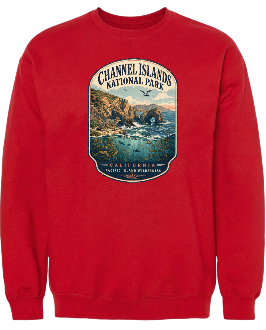 A red sweatshirt with a graphic design depicting a scenic landscape with cliffs, water, and birds.