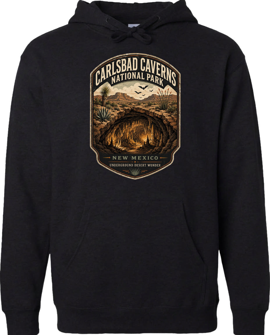 A black hoodie with a graphic design depicting the Carlsbad Caverns National Park in New Mexico.
