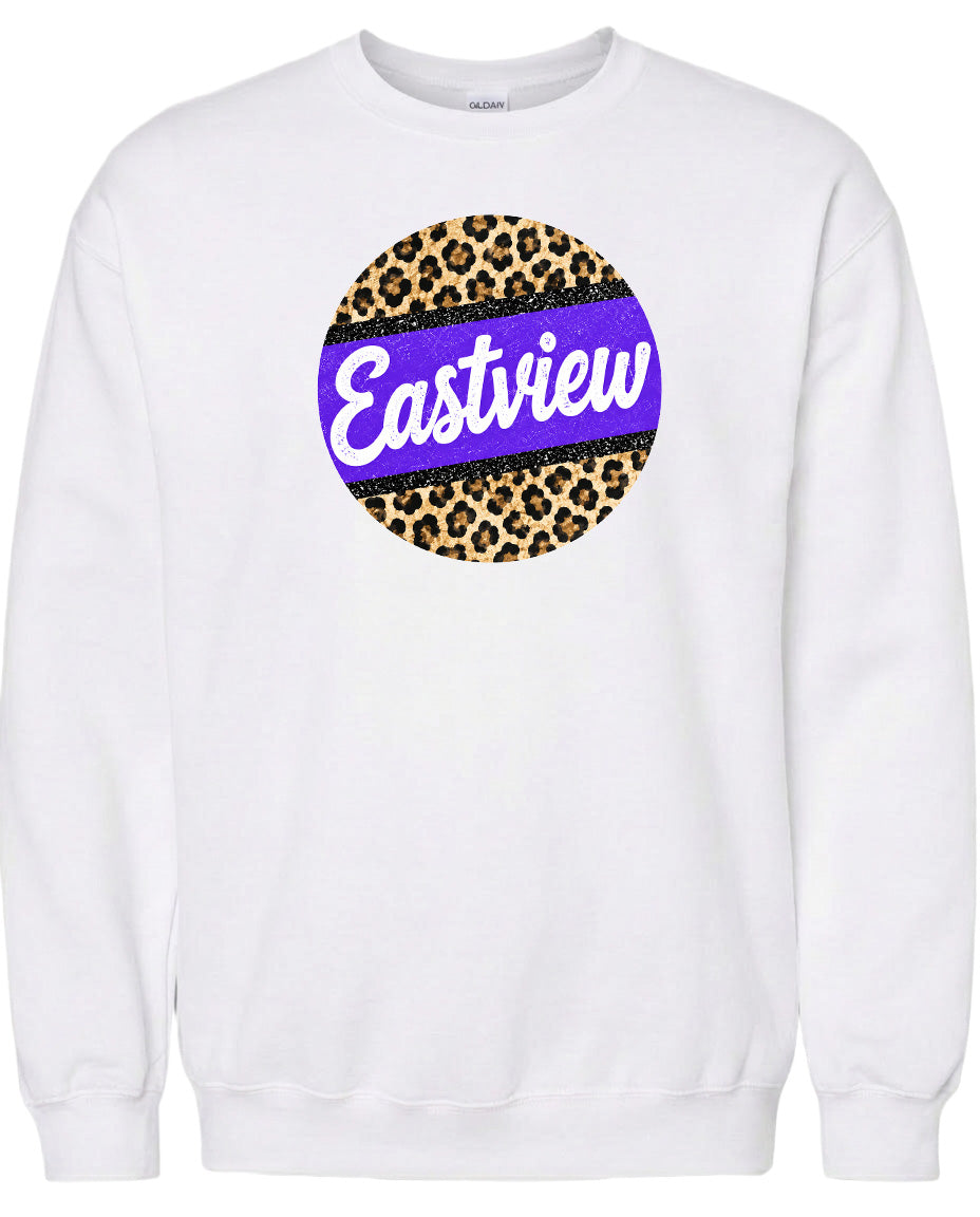 A white sweatshirt with a circular design featuring a leopard print pattern and the word "Eastview" written in purple.
