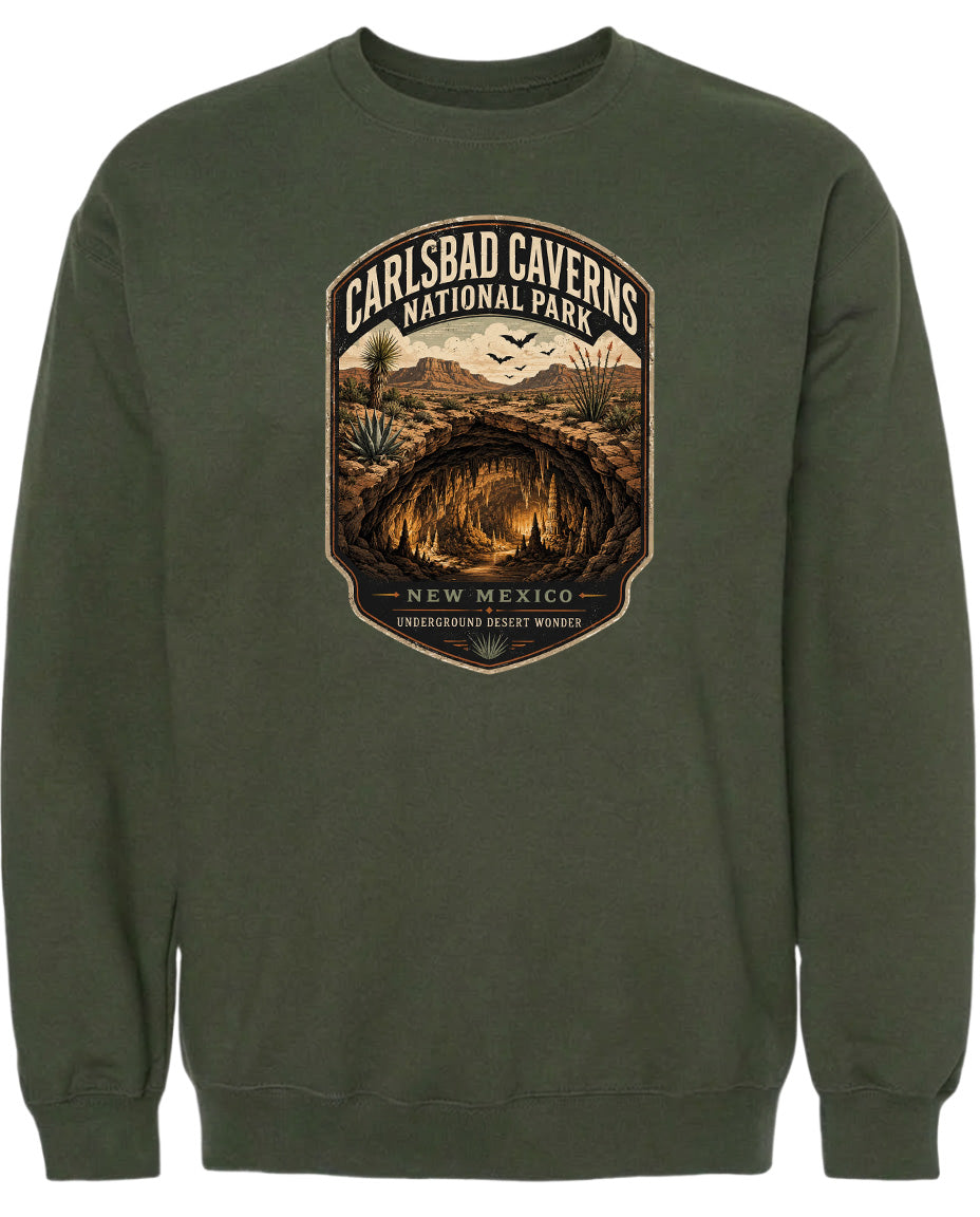 A green sweatshirt with a graphic design depicting the Carlsbad Caves National Park in New Mexico.