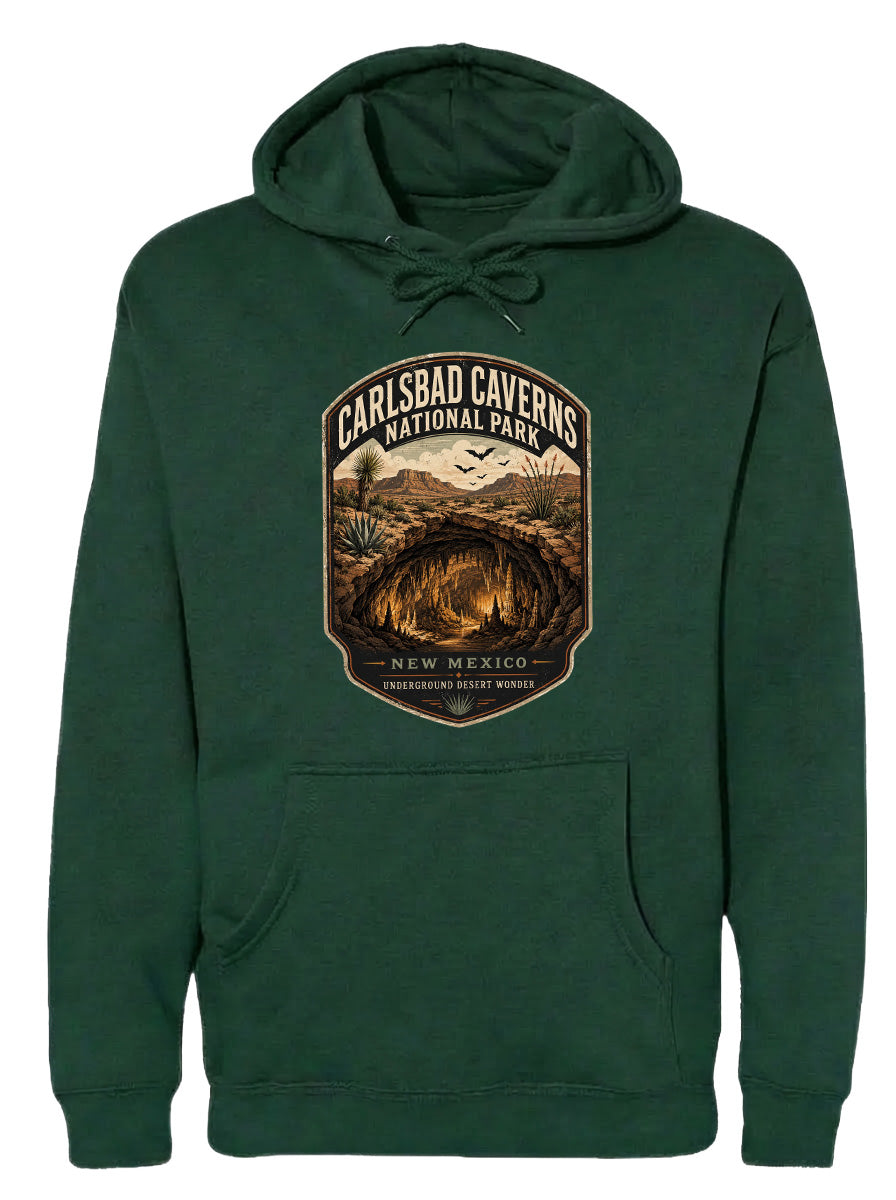 A green hoodie with a graphic design depicting the Carlsbad Caves National Park in New Mexico.