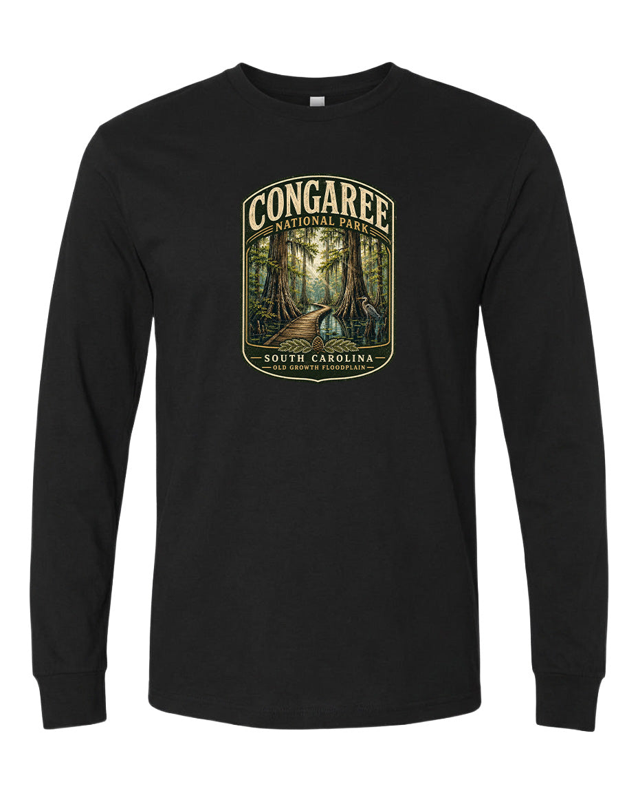 A black long-sleeve t-shirt with a graphic design depicting a forest scene with a path leading through it.
