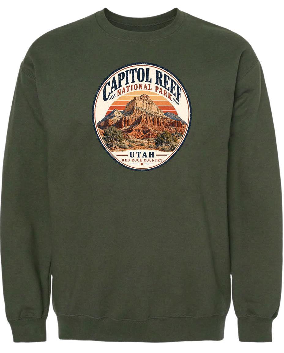 A green sweatshirt with a circular design featuring the Capitol Reef National Park in Utah.