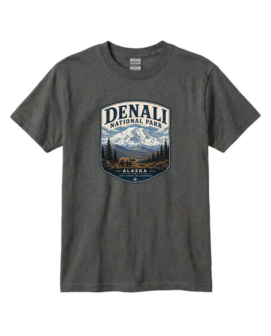 A gray t-shirt with a graphic design depicting a mountain landscape with a bear, surrounded by text that says "DENALI NATIONAL PARK ALASKA LAST GREAT WILDERNESS".