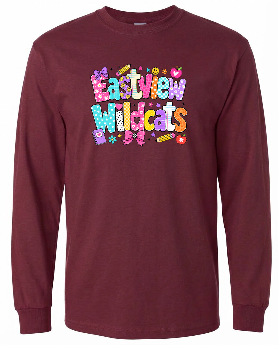 A burgundy long-sleeved t-shirt with a colorful graphic design featuring the text "Eastview Wildcats" in a playful, cartoon-like font.