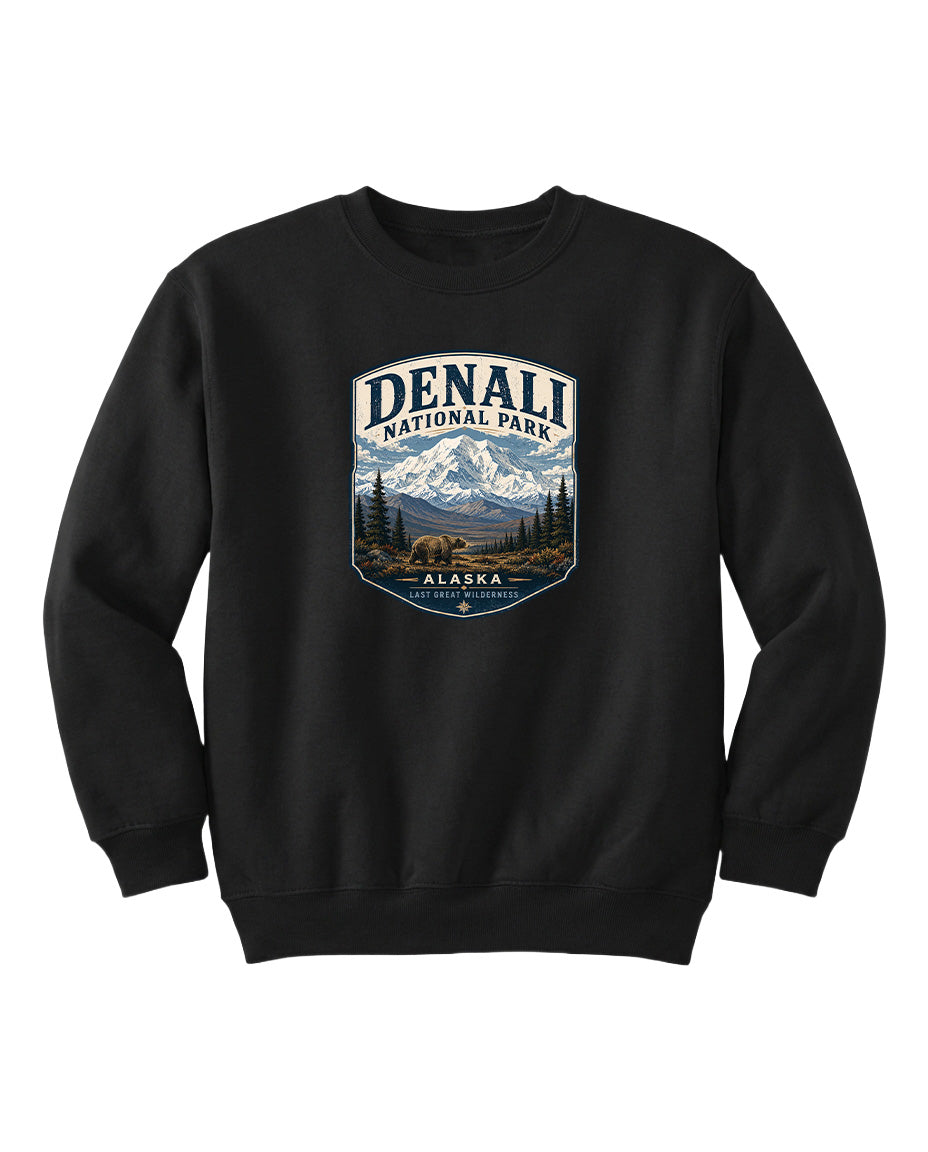 A black sweatshirt with a graphic design featuring a mountain landscape and a bear.