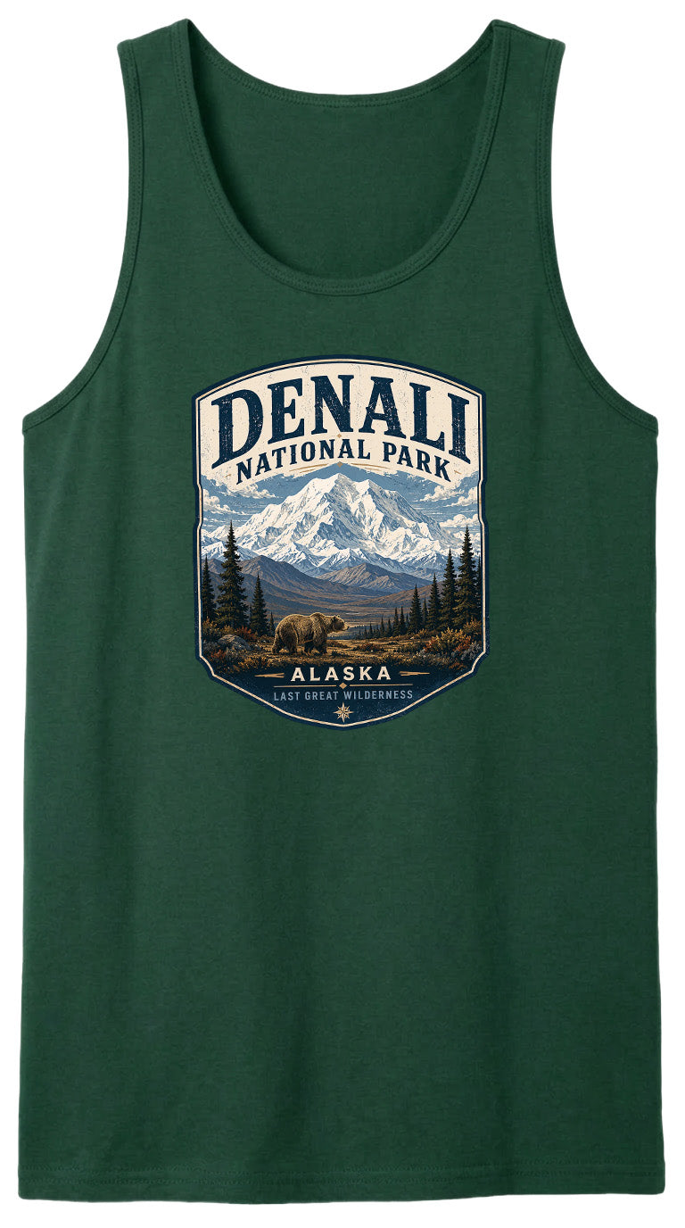 A green tank top with a graphic design featuring a mountain landscape and a bear, along with the text "DENALI NATIONAL PARK ALASKA LAST GREAT WILDERNESS".