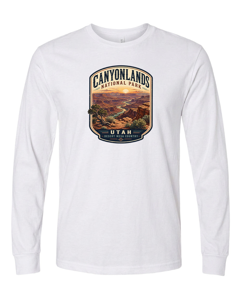 A white long-sleeved t-shirt with a graphic design depicting the scenic landscape of Canyonlands National Park in Utah.