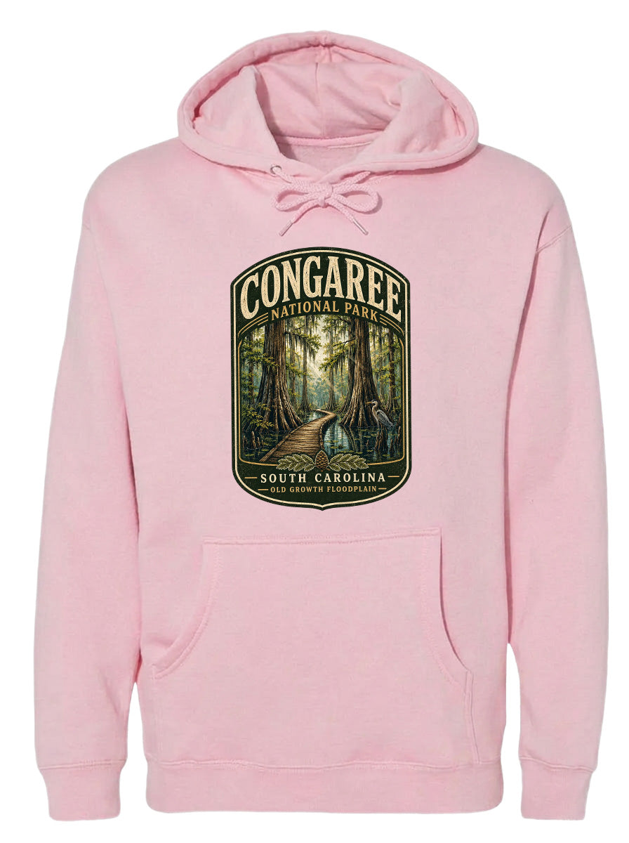 A pink hoodie with a graphic design depicting a forest scene, specifically the Congaree National Park in South Carolina.