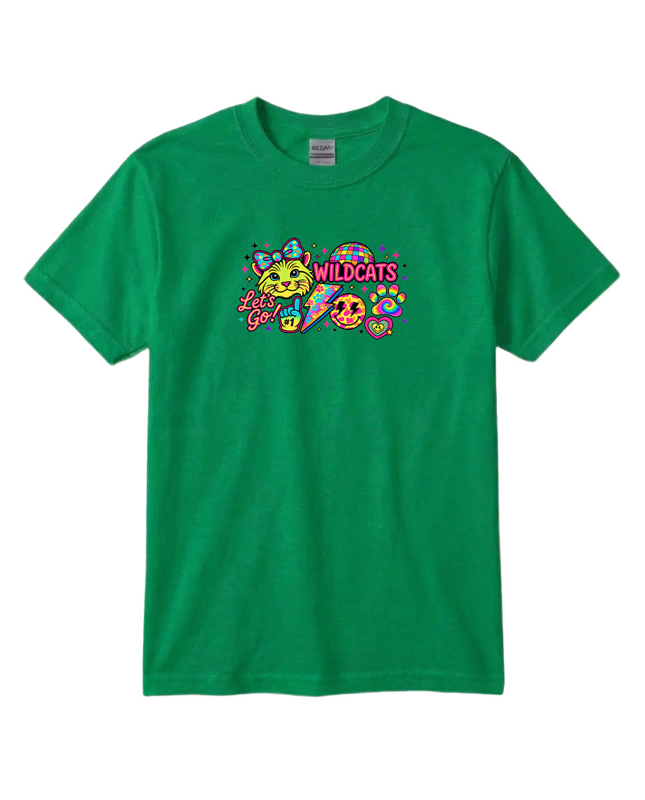 A green t-shirt with a colorful graphic design featuring a smiling face, a cat, and the text "Wildcats" written in a playful font.