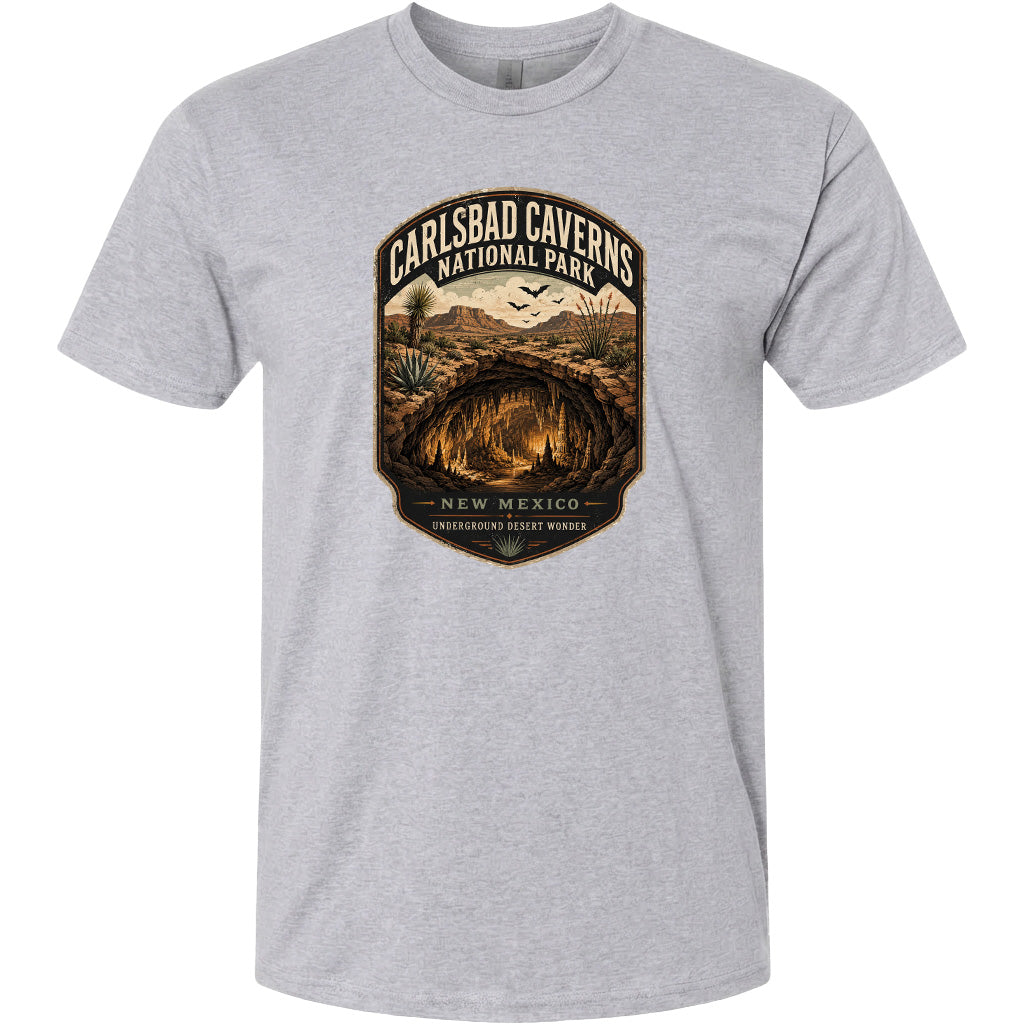 A gray t-shirt with a graphic design depicting the Carlsbad Caverns National Park in New Mexico.