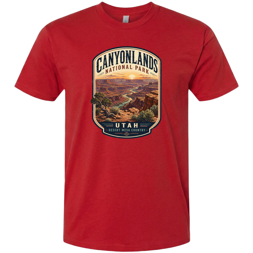 A red t-shirt with a graphic design depicting a scenic landscape of the Canyonlands National Park in Utah.