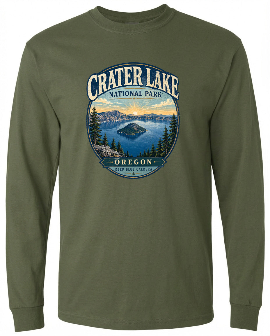 A green long-sleeved t-shirt with a graphic design depicting Crater Lake National Park in Oregon.