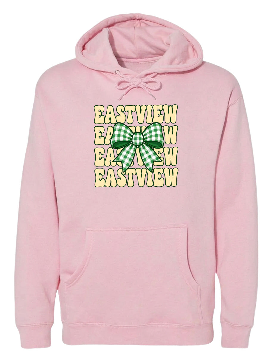 A pink hoodie with a green and white checkered bow on the front.