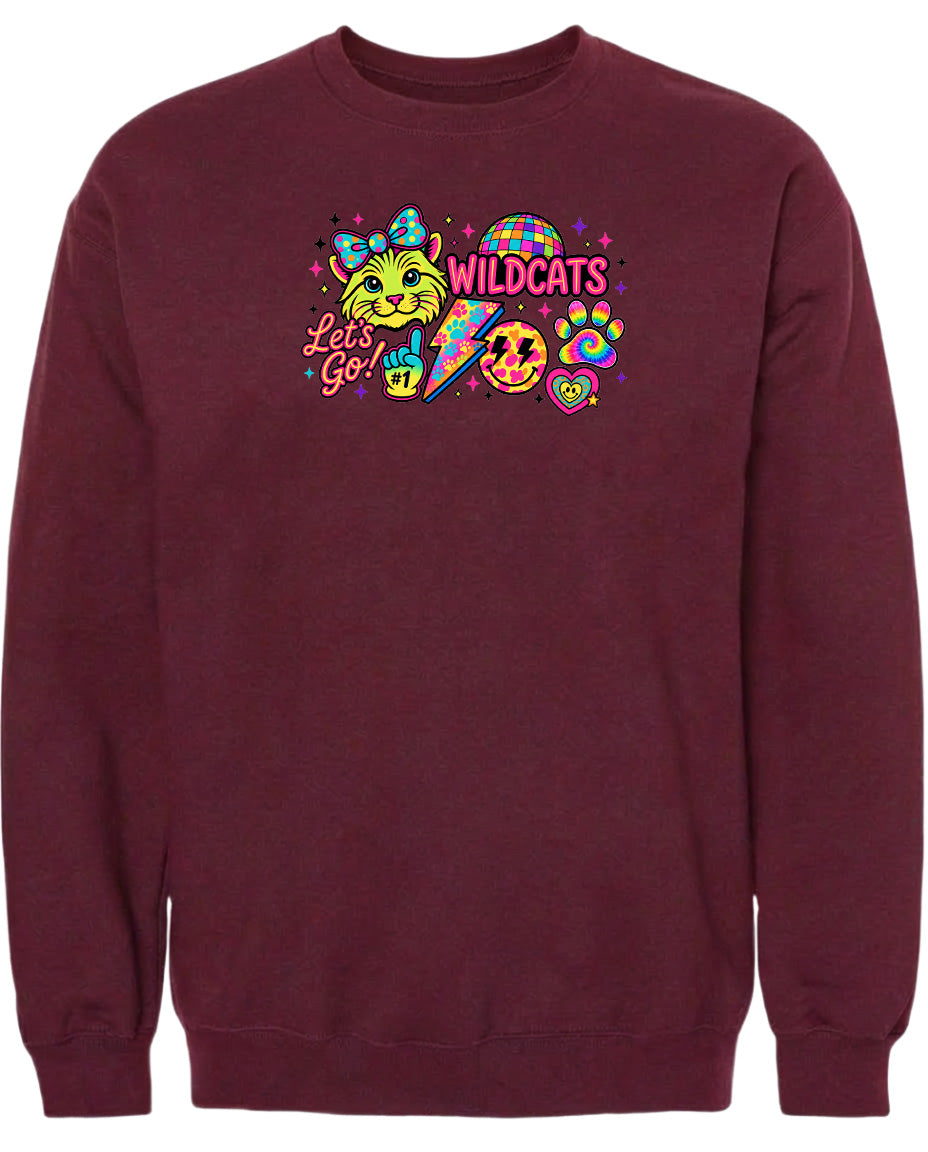 A burgundy sweatshirt with a colorful graphic design featuring a cat, a rainbow, and various other elements.