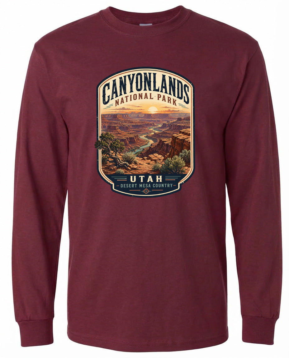 A long-sleeved burgundy t-shirt with a graphic design depicting the scenic landscape of Canyonlands National Park in Utah, USA.