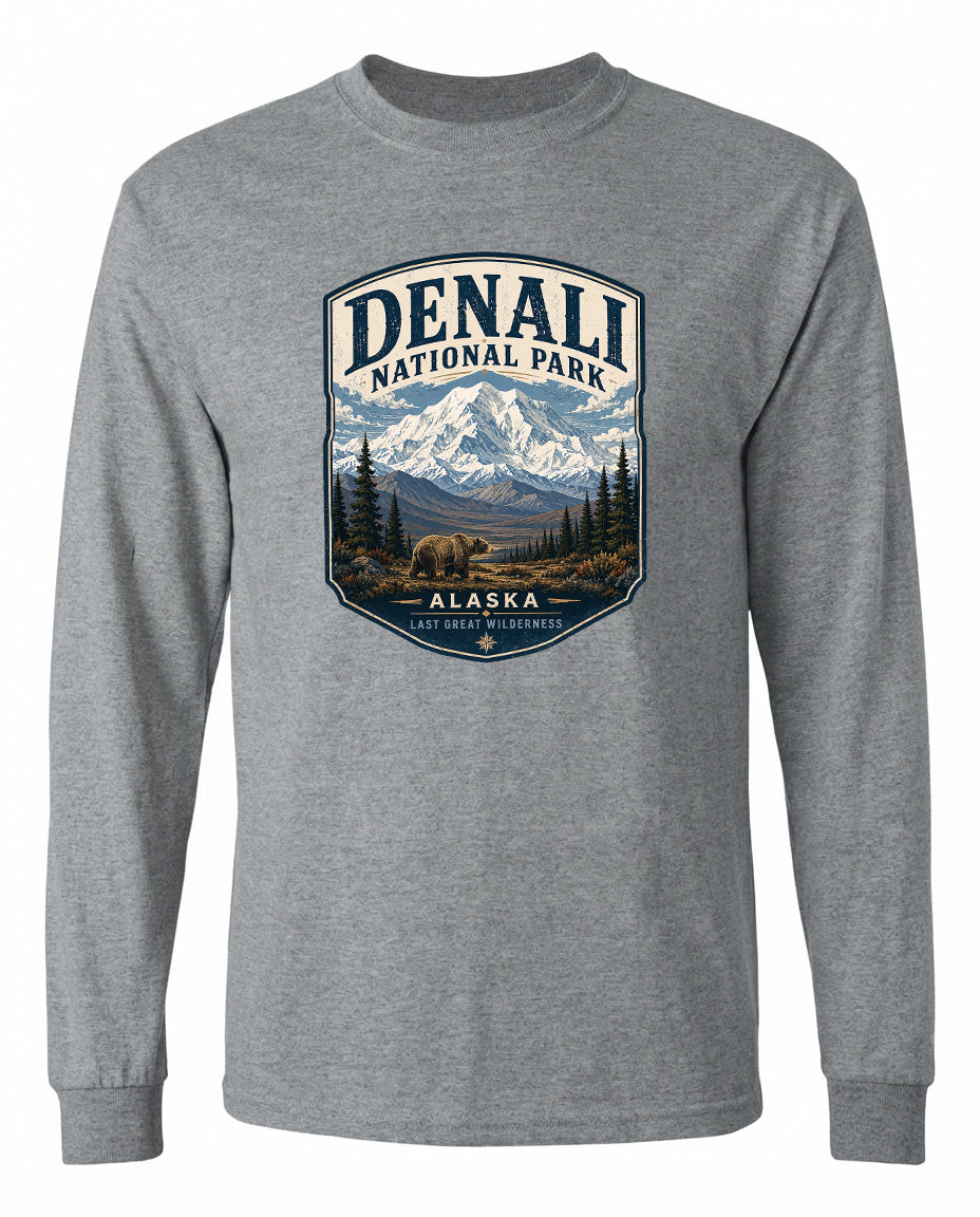 A gray long-sleeved t-shirt with a graphic design depicting Denali National Park in Alaska, featuring a mountain landscape with a bear in the foreground.