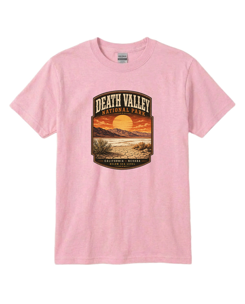 A pink t-shirt with a graphic design depicting a sunset over Death Valley National Park, California, Nevada.