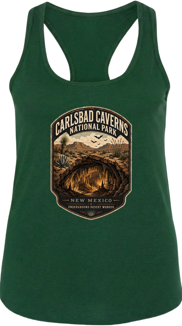 A green tank top with a graphic design depicting the Carlsbad Caverns National Park in New Mexico, featuring a cave, desert landscape, and birds in flight.