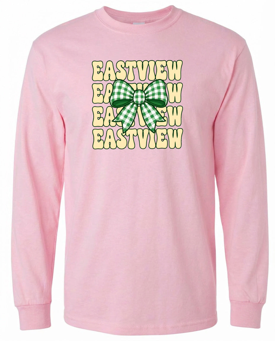 A pink long-sleeved shirt with a graphic design featuring a green and white bow on the front.