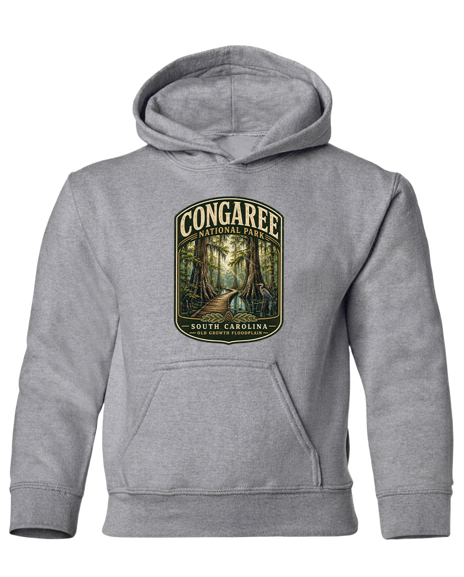 A gray hooded sweatshirt with a graphic design depicting a forest scene and the text "CONGAREE NATIONAL PARK SOUTH CAROLINA" printed on it.
