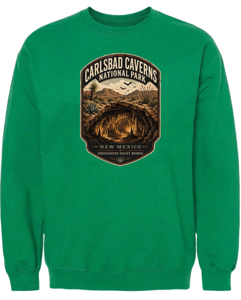 A green sweatshirt with a graphic design depicting the Carlsbad Caverns National Park in New Mexico.