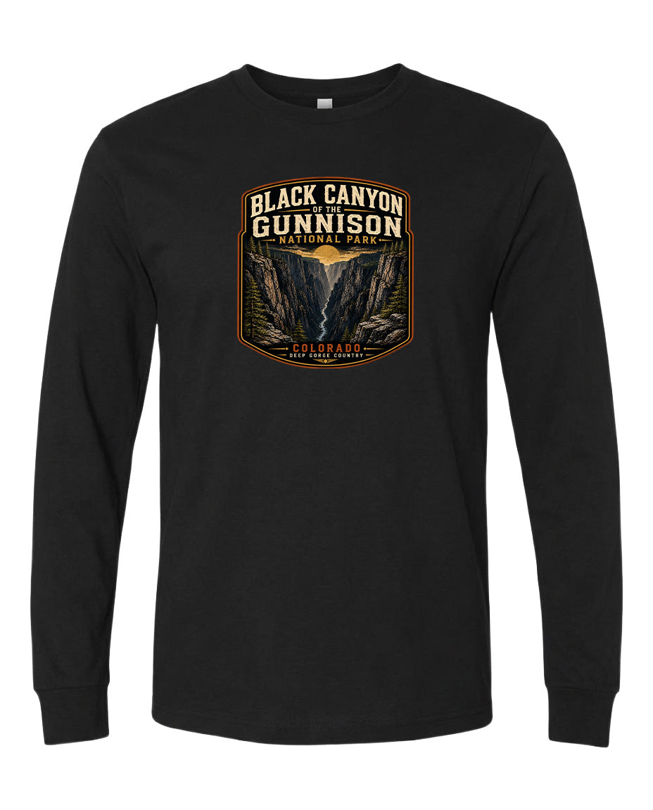 A black long-sleeve t-shirt with a graphic design depicting the Black Canyon of the Gunnison National Park in Colorado.