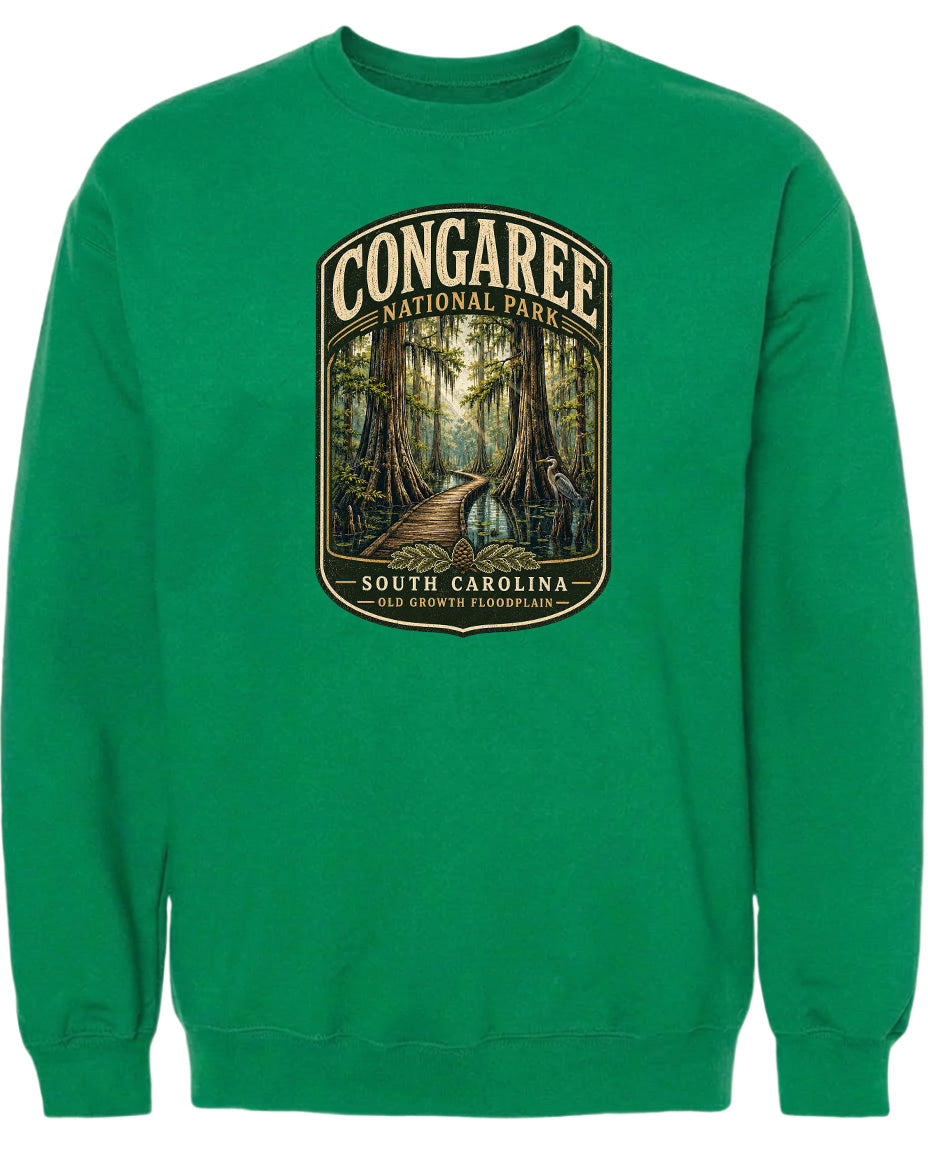 A green sweatshirt with a graphic design depicting a forest scene with a path leading through it.