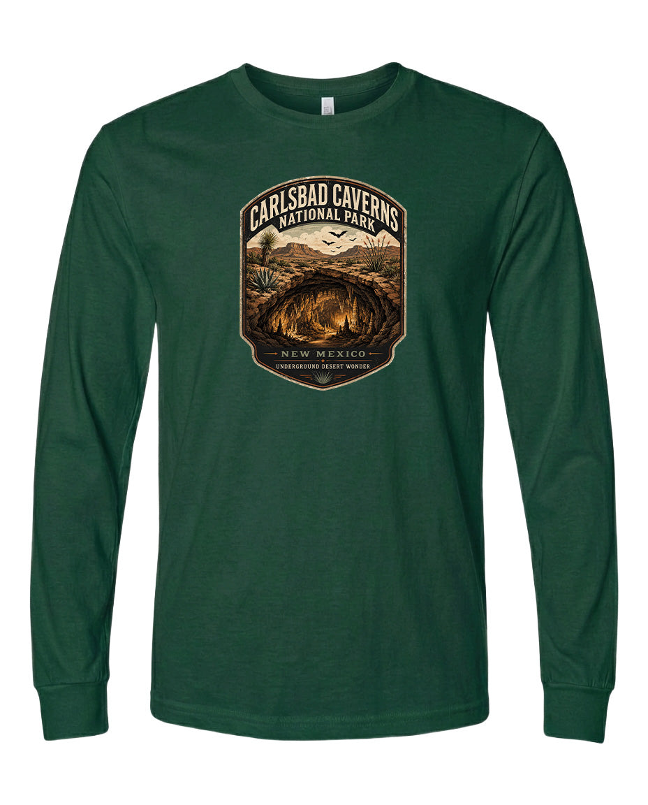 A green long-sleeved t-shirt with a graphic design depicting the Carlsbad Caves National Park in New Mexico.