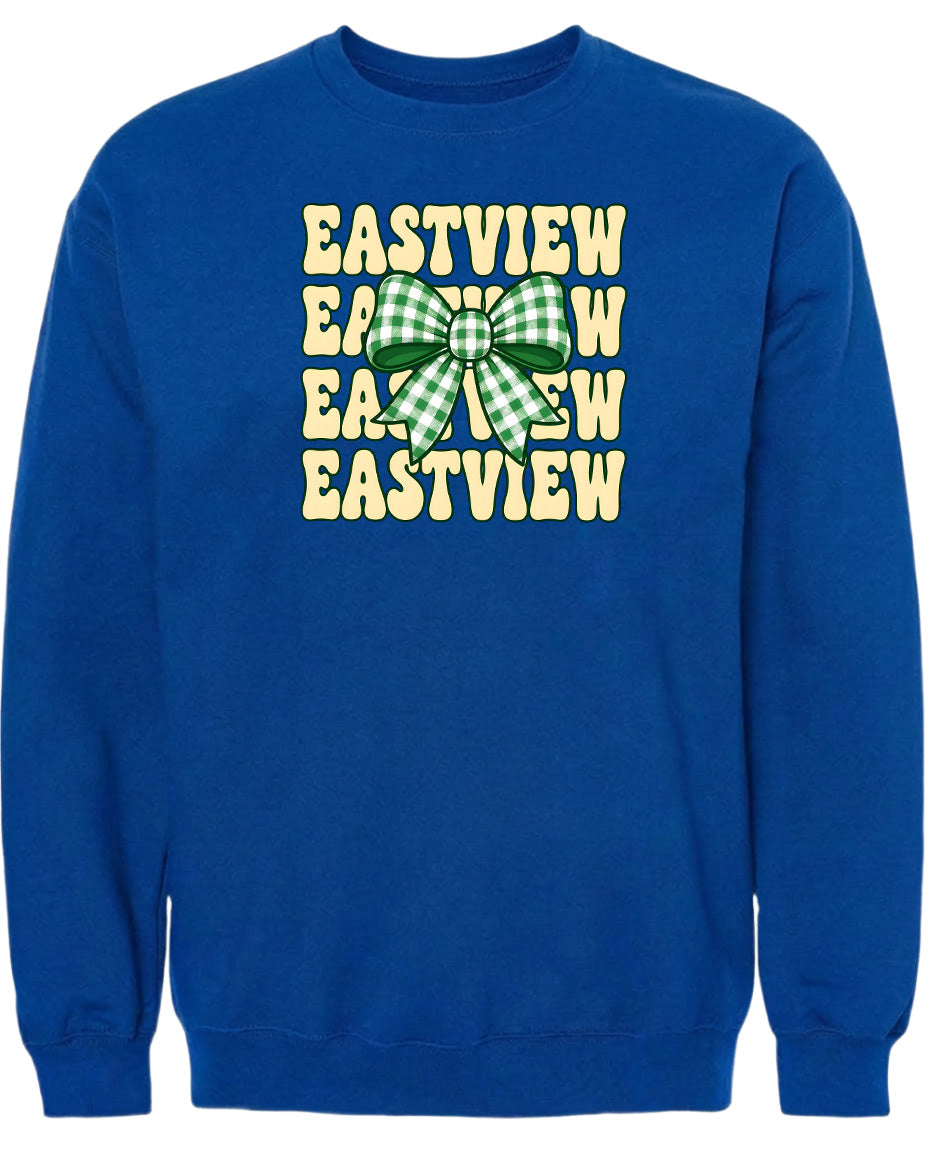 A blue sweatshirt with a graphic design featuring a green and white checkered bow on the front.