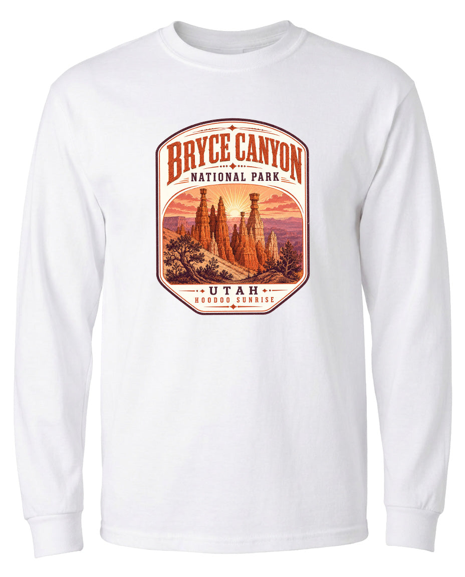 A white long-sleeved t-shirt with a graphic design depicting the Bryce Canyon National Park in Utah.