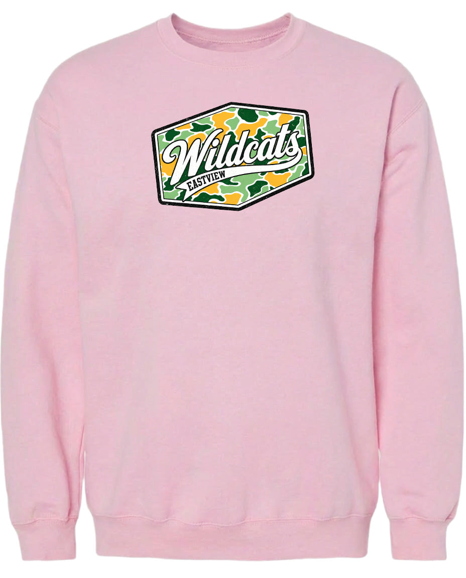 A pink sweatshirt with a graphic design featuring the word "Wildcats" in a stylized font.
