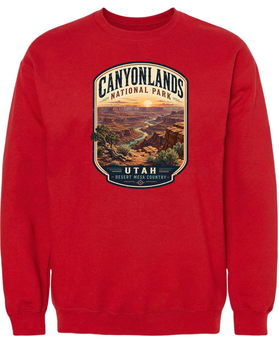 A red sweatshirt with a graphic design depicting the scenic landscape of Canyonlands National Park in Utah.