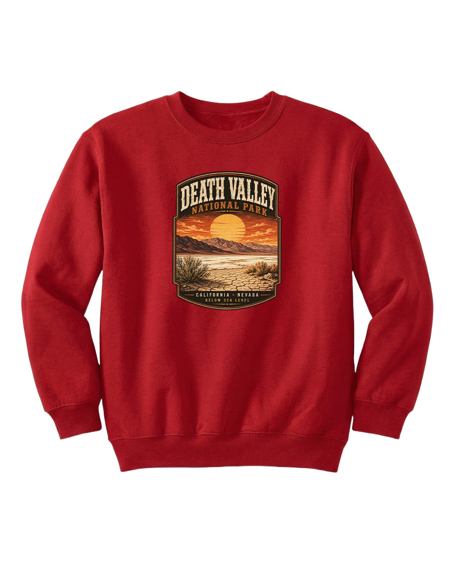 A red sweatshirt with a graphic design depicting a sunset over Death Valley National Park.