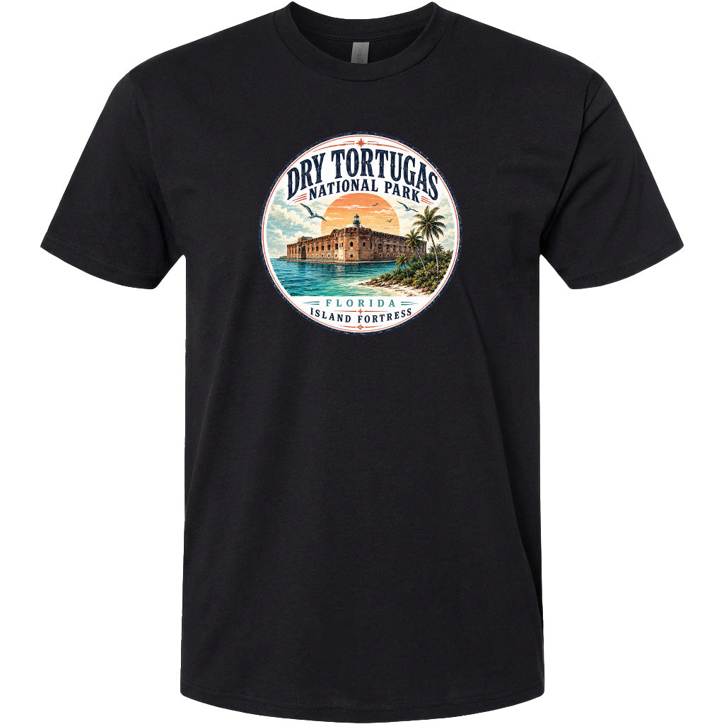 A black t-shirt with a circular graphic design featuring a tropical beach scene with palm trees, a building, and a sunset.