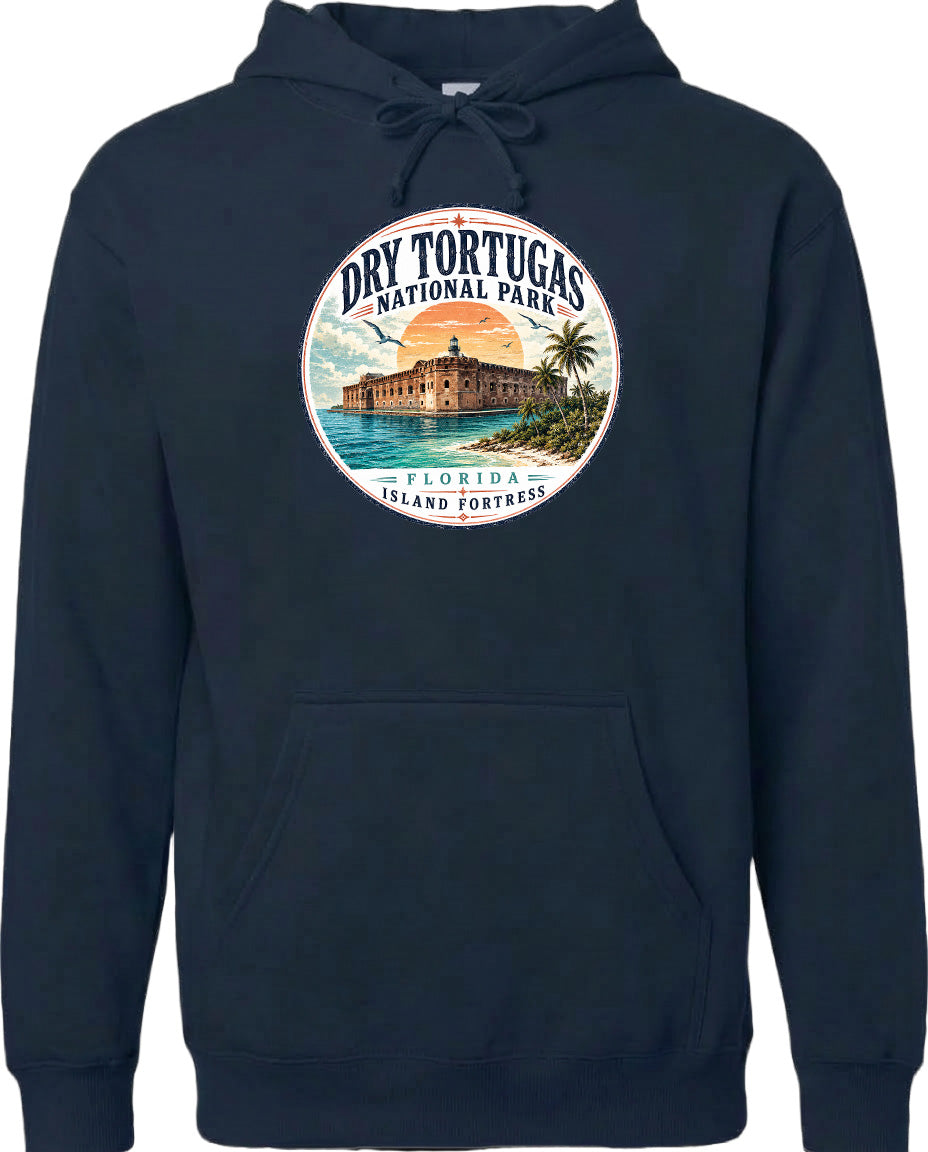 A navy blue hoodie with a circular design featuring a tropical island and a building, along with the text "Dry Tortugas National Park, Florida Island Fortress".