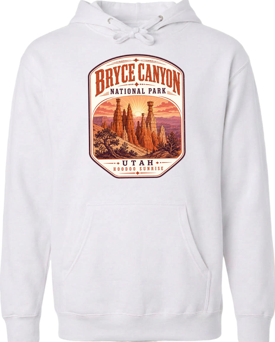 A white hoodie with a graphic design depicting Bryce Canyon National Park and Utah.