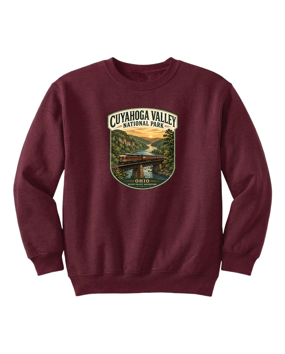 A burgundy sweatshirt with a graphic design depicting a scenic view of the Cuyahoga Valley National Park in Ohio.