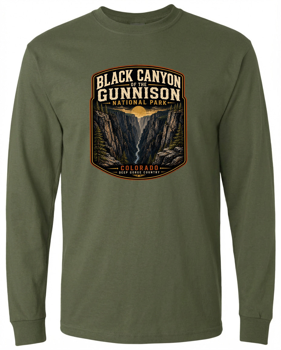 A long-sleeved green t-shirt with a graphic design depicting the Black Canyon of the Gunnison National Park in Colorado.