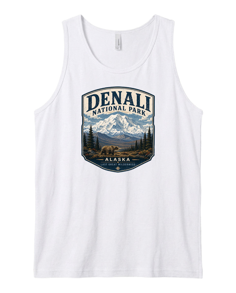 A white tank top with a graphic design depicting Denali National Park in Alaska, featuring a mountain landscape with a bear in the foreground.