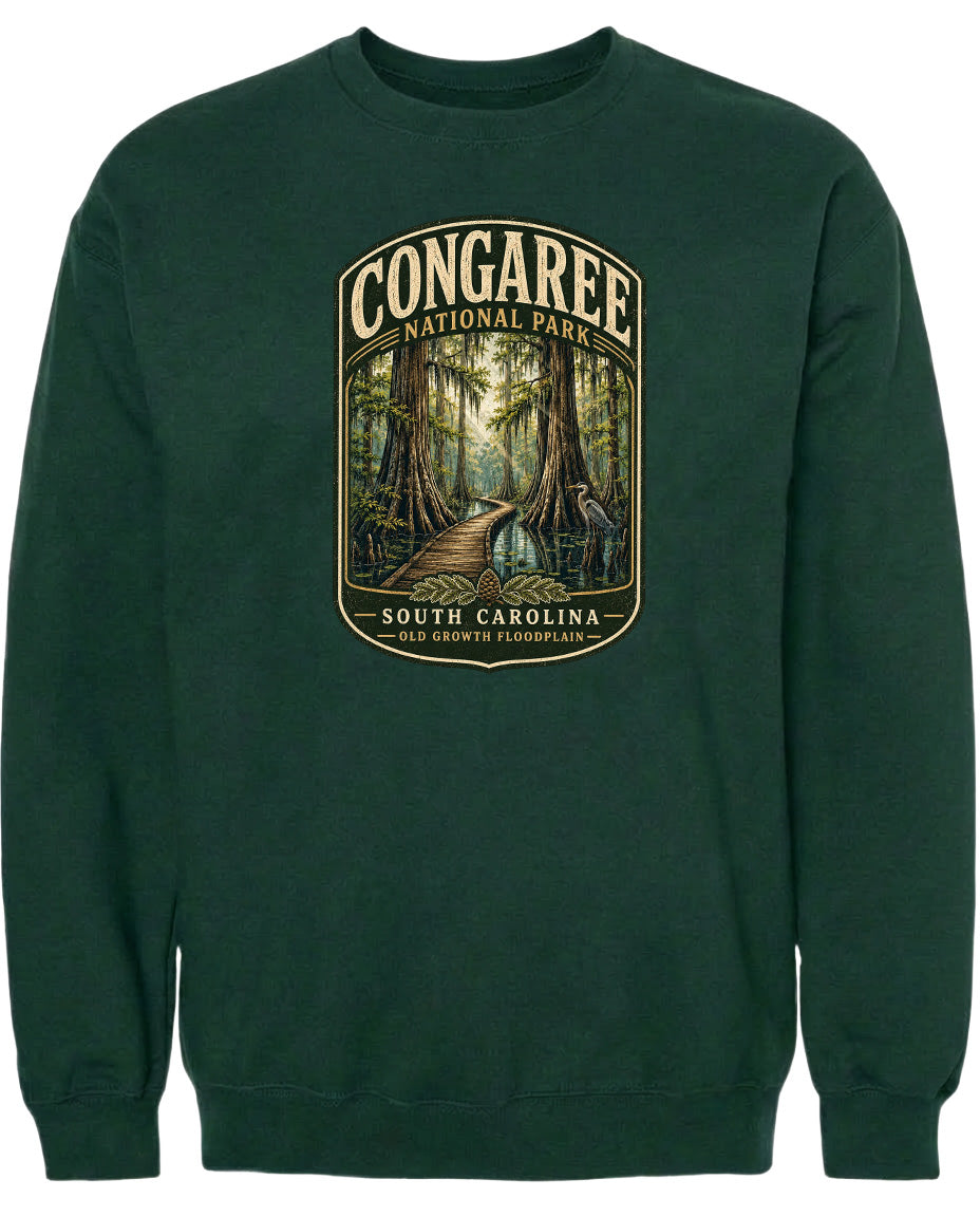 A green sweatshirt with a graphic design depicting a forest scene with a path leading through it.