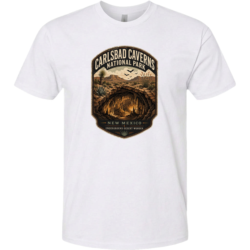 A white t-shirt with a graphic design depicting the Carlsbad Caves National Park in New Mexico.