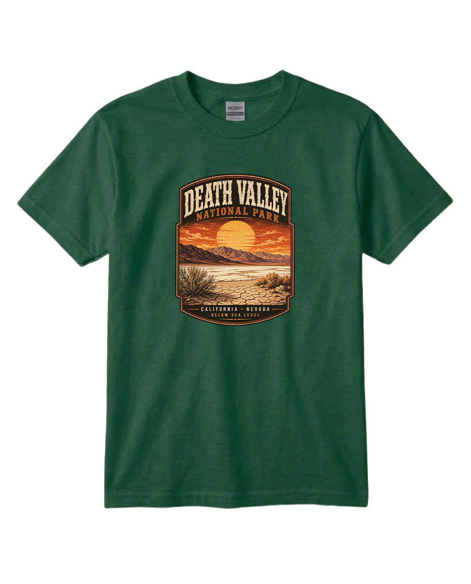 A green t-shirt with a graphic design depicting a sunset over Death Valley National Park, California, USA.