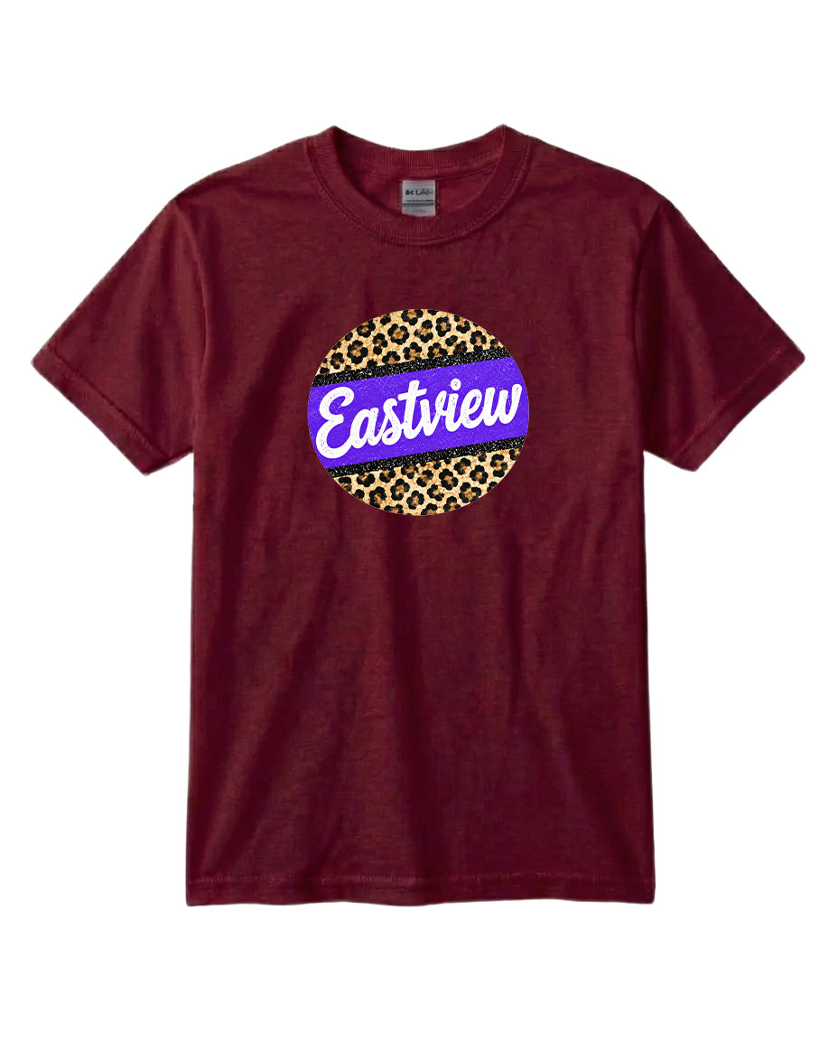 A burgundy-colored t-shirt with a circular graphic design on the front. The design consists of a leopard print circle with a purple border, and the word "Eastview" written in white cursive letters inside the circle.