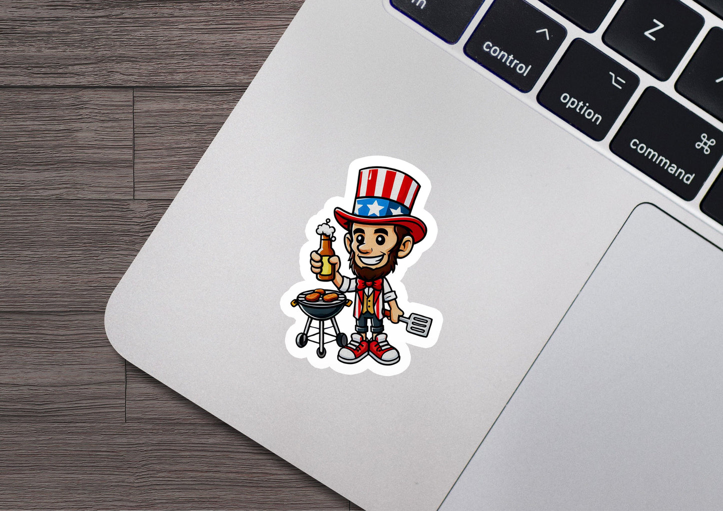 a laptop with a sticker of a cartoon character
