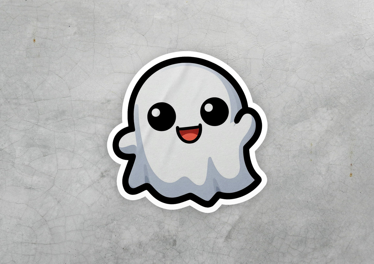 a sticker of a ghost on a concrete surface