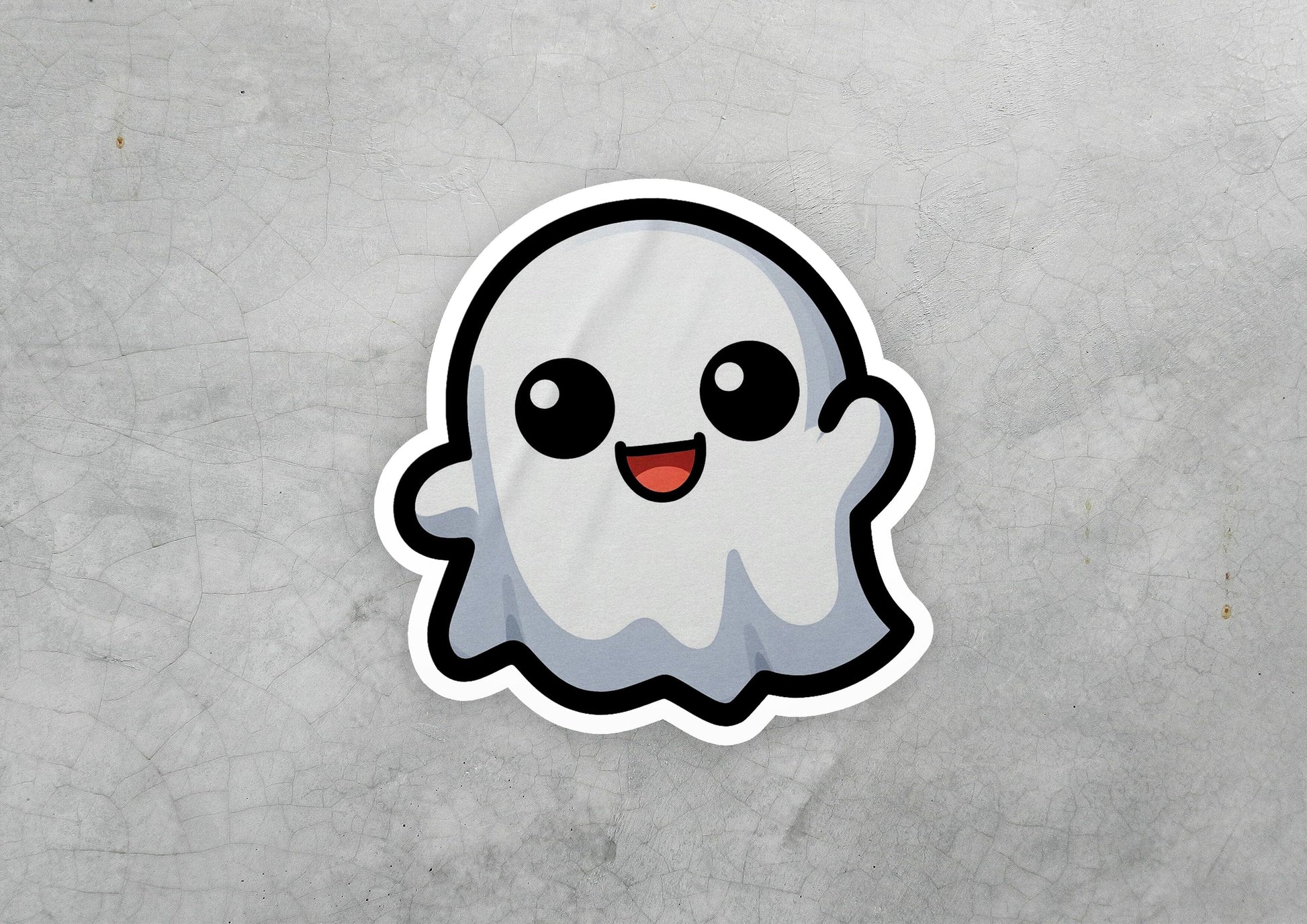 a sticker of a ghost on a concrete surface