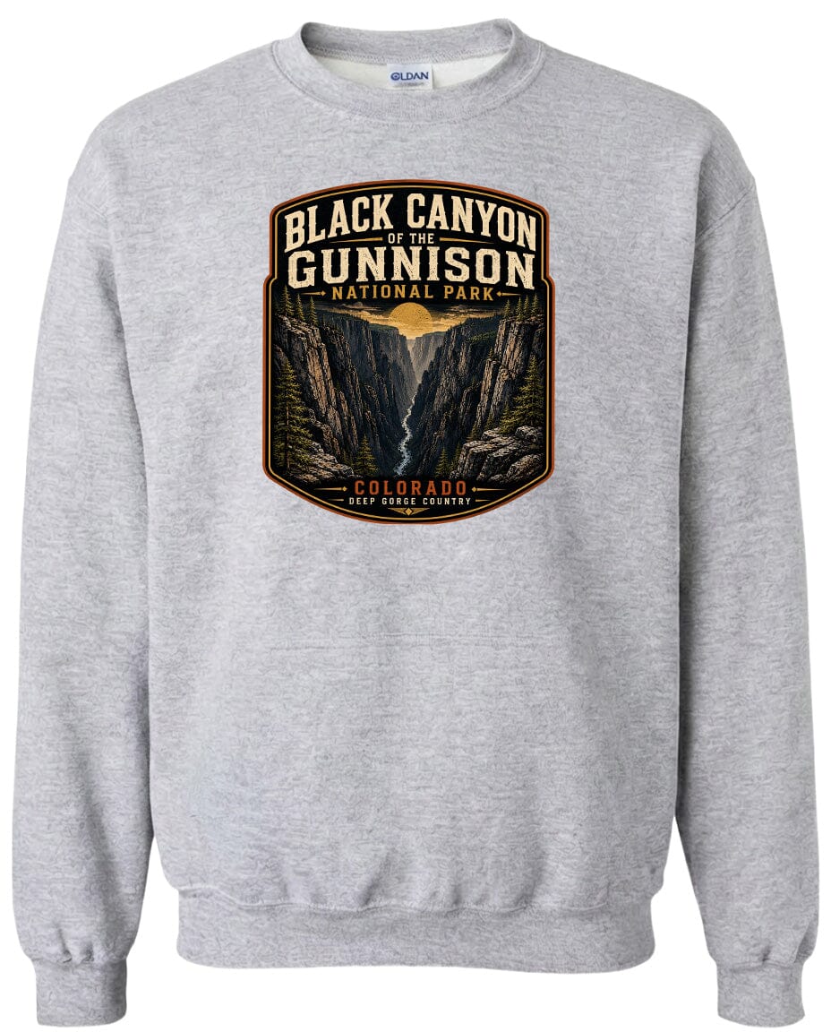 A gray sweatshirt with a graphic design depicting the Black Canyon of the Gunnison National Park in Colorado.