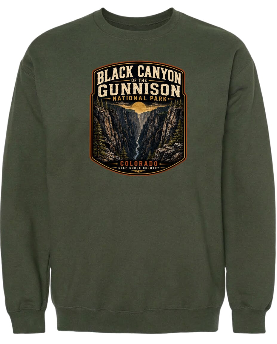 A green sweatshirt with a graphic design depicting the Black Canyon of the Gunnison National Park in Colorado.