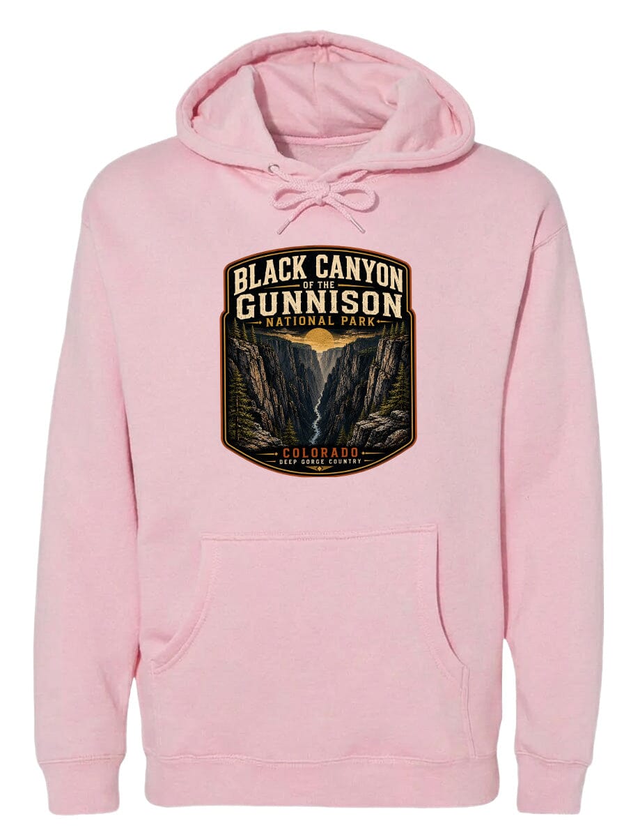 A pink hoodie with a graphic design depicting the Black Canyon of the Gunnison National Park in Colorado.